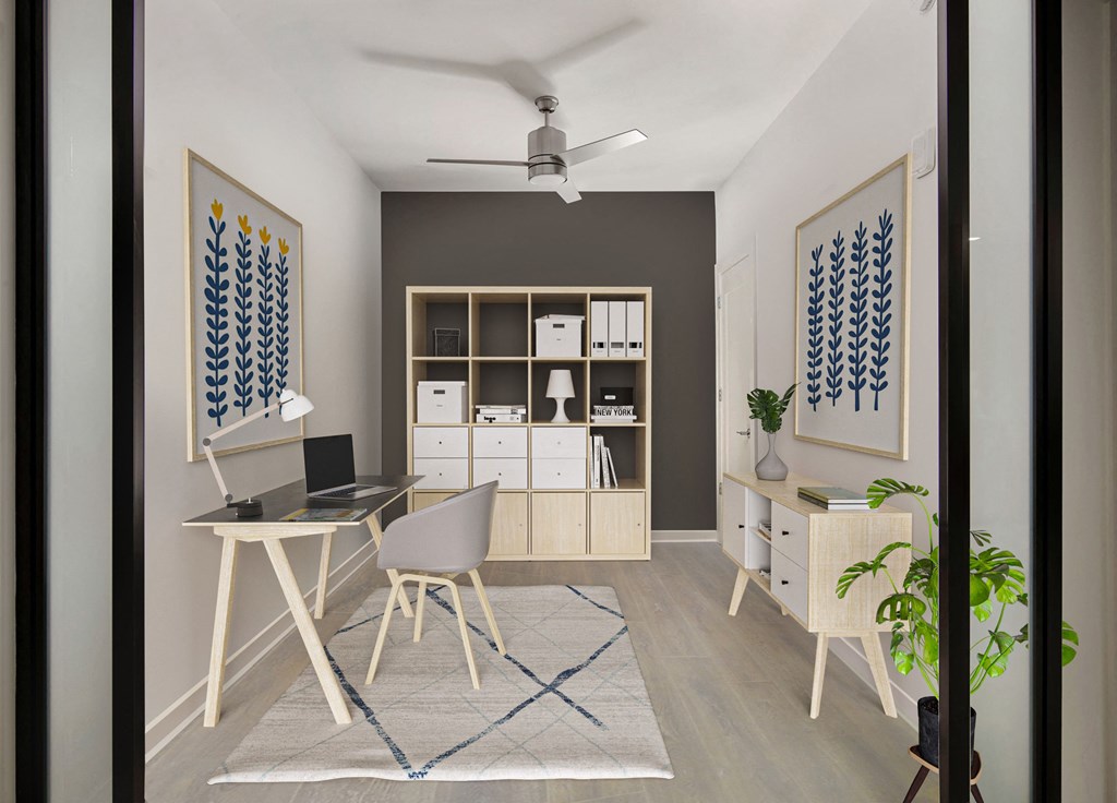 a home office with a white desk and white chairs with a blue and white rug a home office with a white desk and white chairs with a blue and white rug at SLX Atlanta, Chamblee, Georgia